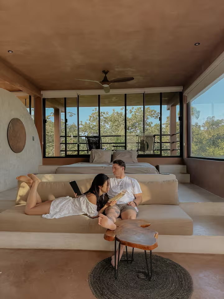 Revivis Suite — sunlit lounge area with jungle views