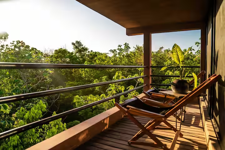Revivis Suite — private balcony with treetop loungers