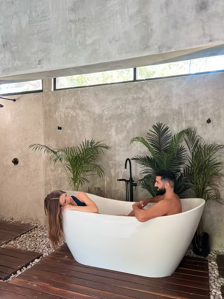 Tirzah Suite — couple relaxing in the outdoor soaking tub