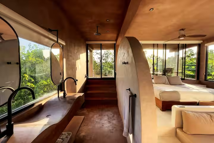 Revivis Suite — open-plan en-suite with treetop shower and bath